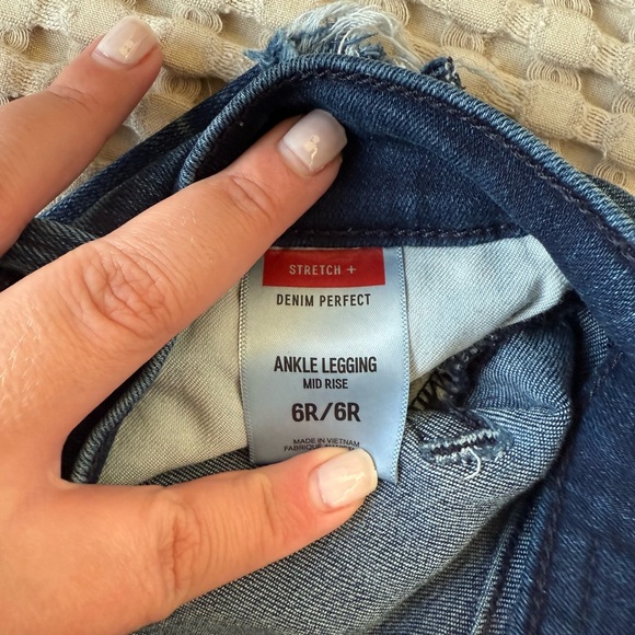 Express dark wash skinny jeans with distressed bottoms. - Picture 4 of 4